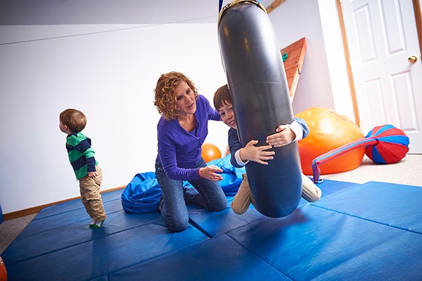Dr. Roseanne Schaaf using sensory integration therapy with child with autism